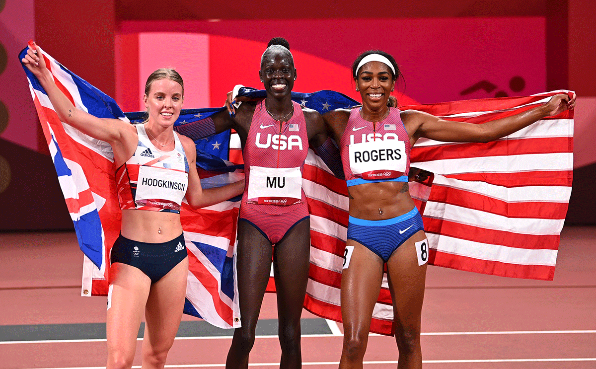 Women's 800m gold medallist, Athing Mu of the United States is flanked by compatriot and bronze medallist, Raevyn Rogers and silver medallist, Keely Hodgkinson of Britain