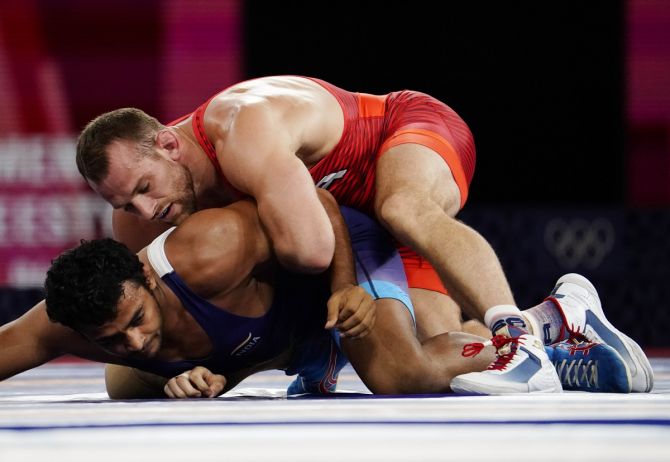 India's Deepak Punia is pinned down by David Moris Taylor of the United States during the Olympics men's Freestyle (86kg) semi-final