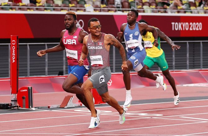 Canada's Andre de Grasse glances to his left as he finishes ahead of Kenneth Bednarek of the United States to win the gold medal in the Olympics men's 200 metres final, at Olympic Stadium in Tokyo, on Wednesday.