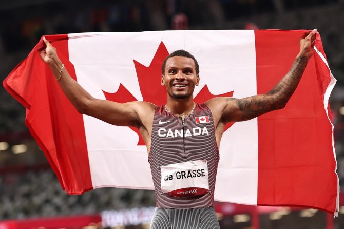 Andre De Grasse celebrates after winning the Tokyo Olympics gold medal in the men's 200 metres.