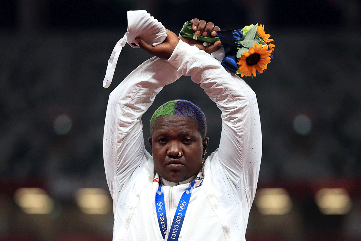 Shot Put silver medallist, Raven Saunders of the United States gestures on the podium. Earlier this week, the IOC said it was investigating after shot put silver medallist American Raven Saunders had raised her arms in an X above her head in Sunday's medal ceremony, which she later indicated was an expression of support for the oppressed.