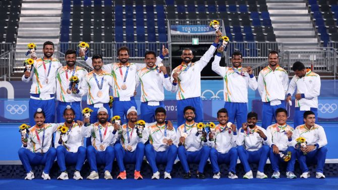 India's players pose with their bronze medals after the Olympics men's hockey victory ceremony, at Oi Hockey Stadium in Tokyo, on Thursday.
