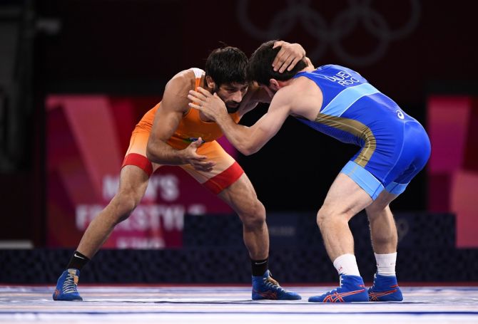 India's Ravi Kumar Dahiya in action against Zavur Uguev of the Russian Olympic Committee during the Olympics men's 57kg Freestyle final, at Makuhari Messe Hall A, Chiba, on Thursday.