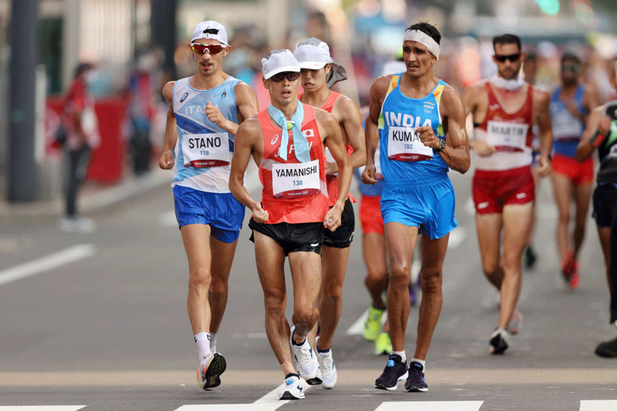 Massimo Stano of Team Italy, Toshikazu Yamanishi of Team Japan and Sandeep Kumar of Team India lead the field during the Men's 20km Race Walk at the Tokyo 2020 Olympic Games at Sapporo Odori Park in Sapporo, on Thursday