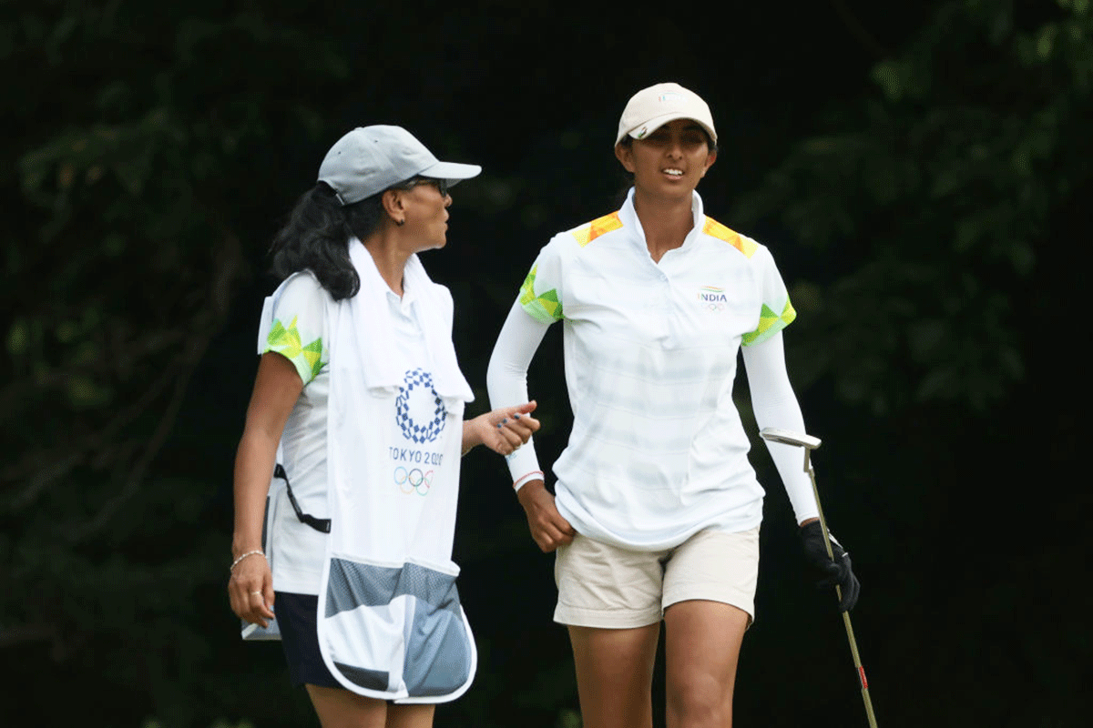 Aditi Ashok celebrates a birdie on the sixth green with her mother Maheshwari Gurappa Bhuyar, who is also her caddie, during the final round of the Women's Individual Stroke Play of the Tokyo 2020 Olympic Games at Kasumigaseki Country Club in Kawagoe, on Saturday