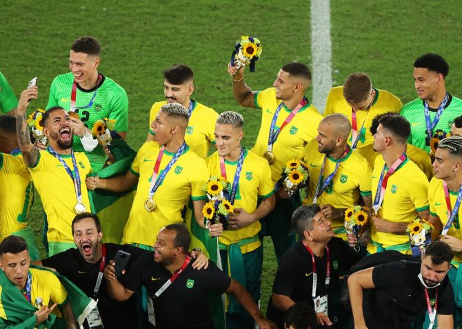 Brazil's players celebrate after the medals ceremony for the Olympics men's football tournament, at International Stadium in Yokohama, Kanagawa, Japan, On Saturday.