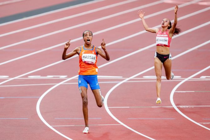 Sifan Hassan of the Netherlands finishes first in the Olympics women's 10,000 metres final, aheaad of Bahrain's Kalkidan Gezahegne, at the Olympic Stadium in Tokyo, on Saturday.