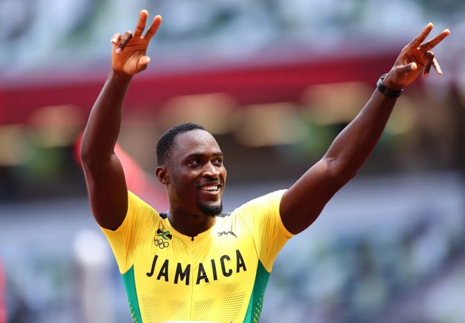 Jamaica's Hansle Parchment celebrates after winning gold in the Olympics men's 110m Hurdles, at Olympic Stadium, in Tokyo, Japan
