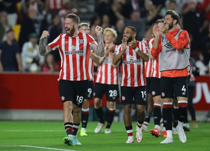   Brentford's Pontus Jansson celebrates with teammates after the match.