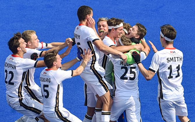 Germany's players celebrate with their goalkeeper Anton Brinckman after beating Spain via the tie-breaker in the quarter-finals of the men's Junior World Cup, at Kalinga Stadium in Bhubaneswar, on Wednesday