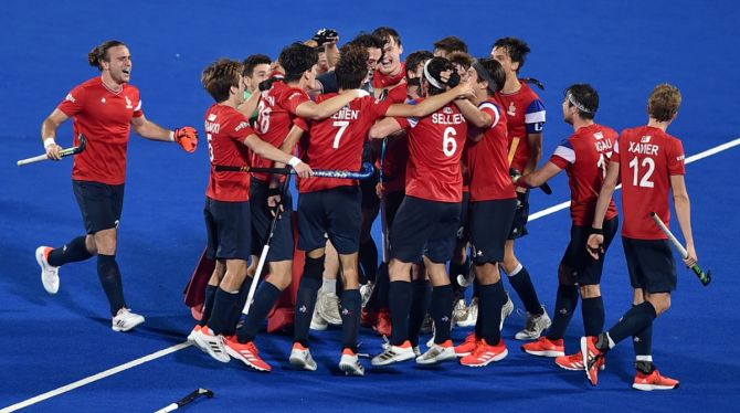 France's players celebrate after beating India in the third-fourth play-off match at the Junior men's Hockey World Cup, at Kalinga stadium in Bhubaneswar, on Sunday.