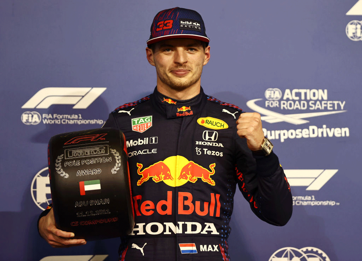 Pole position qualifier Red Bull Racing's Max Verstappen celebrates in parc ferme during qualifying of the F1 Grand Prix of Abu Dhabi at Yas Marina Circuit in Abu Dhabi on Saturday