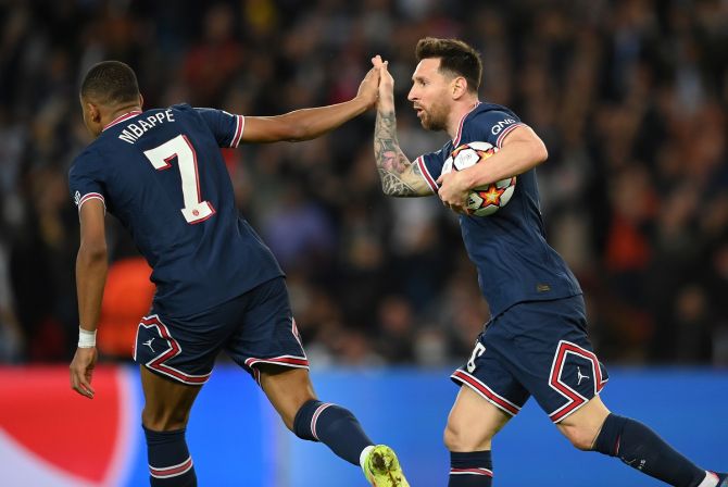 PSG players Kylian Mbappe (left) and Lionel Messi celebrate a goal.
