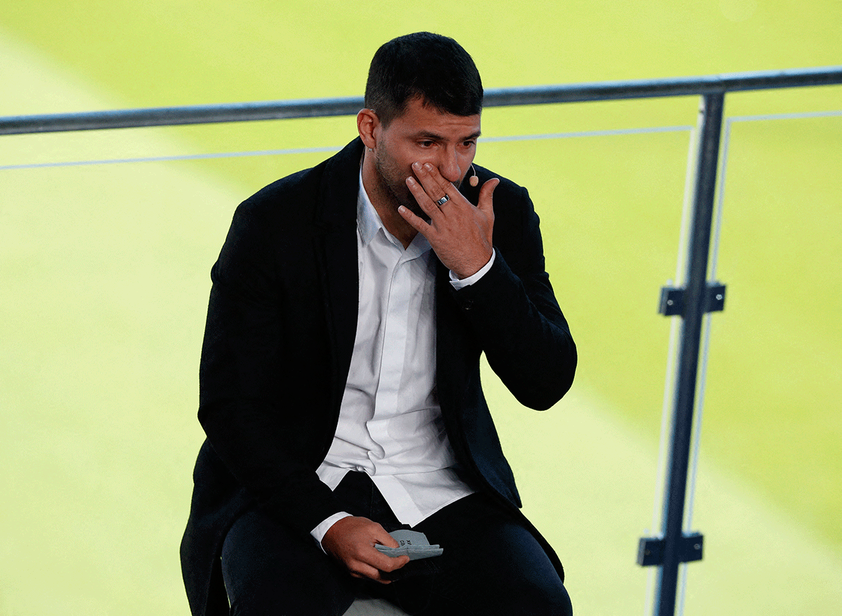 FC Barcelona's Sergio Aguero wipes away tears after announcing his retirement from football during a press conference at Camp Nou in Barcelona on Wednesday 