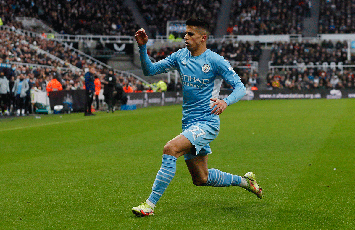 Manchester City's Joao Cancelo celebrates scoring their second goal against Newcastle United at St James' Park, Newcastle on Sunday