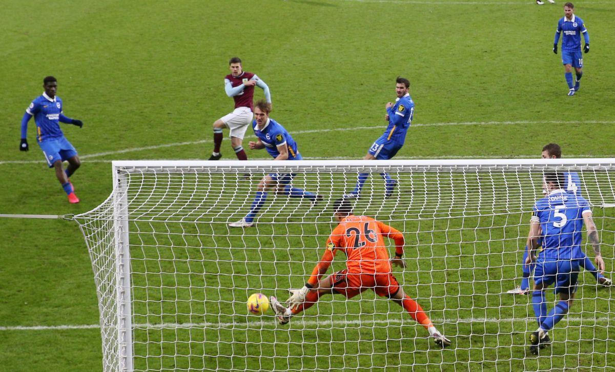 Burnley's Johann Berg Gudmundsson scores their first goal against Brighton & Hove Albion during their match at Turf Moor, Burnley on Saturday