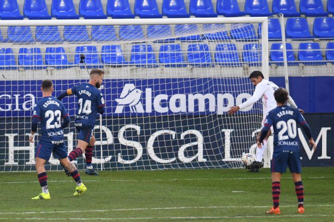 Raphael Varane  scores Real Madrid's second goal during the La Liga Santander match against SD Huesca