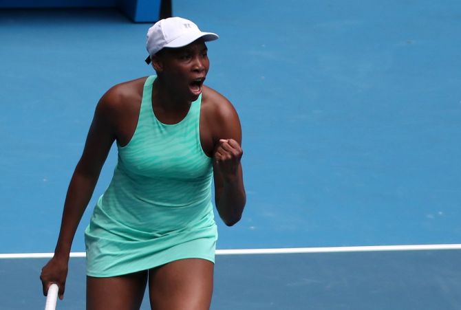 American Venus Williams reacts during her Australian Open first round match against Belgium's Kirsten Flipkens 