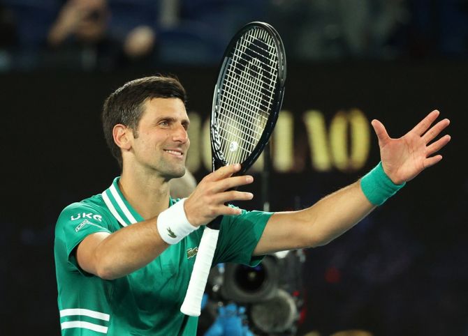 Serbia's Novak Djokovic celebrates winning his first round match against France's Jeremy Chardy at the Australian Open