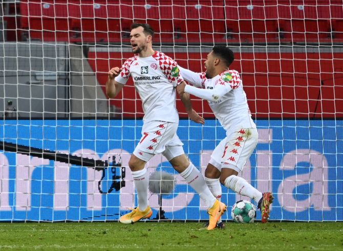 Kevin Stoger celebrates scoring Mainz 05's second goal against Bayer Leverkusen