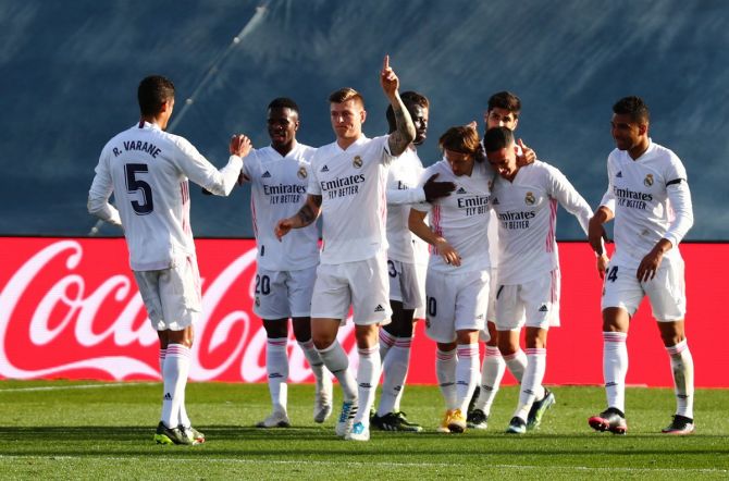 Toni Kroos celebrates with teammates after scoring Real Madrid's second goal in the La Liga match against Valencia