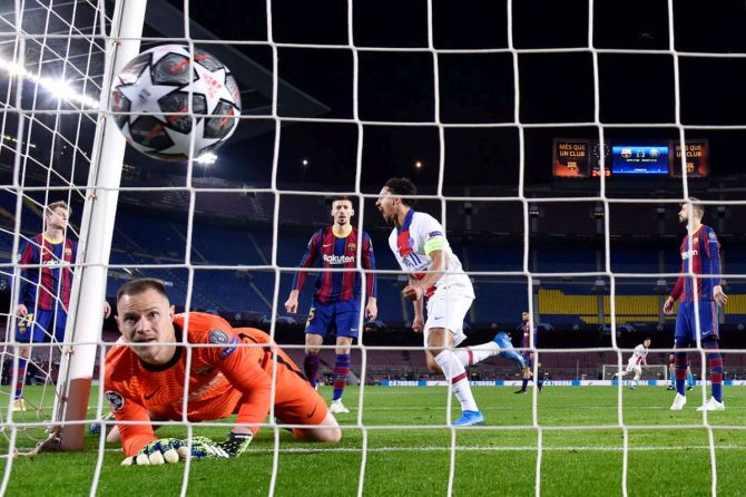 FC Barcelona's keeper Marc-Andre ter Stegen reacts as Moise Keane scores Paris Saint-Germain's third goal during the UEFA Champions League Round of 16 match at Camp Nou in Barcelona