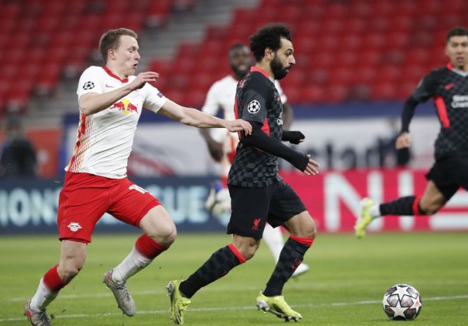 Liverpool's Mohamed Salah scores their first goal against Leipzig during their Champions League Round of 16 first leg match at Puskas Arena, Budapest