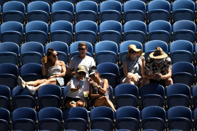 There was a sprinkle of fans in the stands at the Australian Open on Thursday