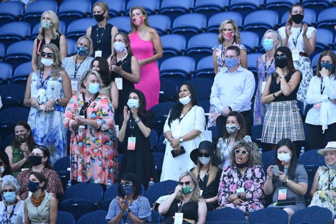 Spectators look on following the semi-final match between Naomi Osaka and Serena Williams