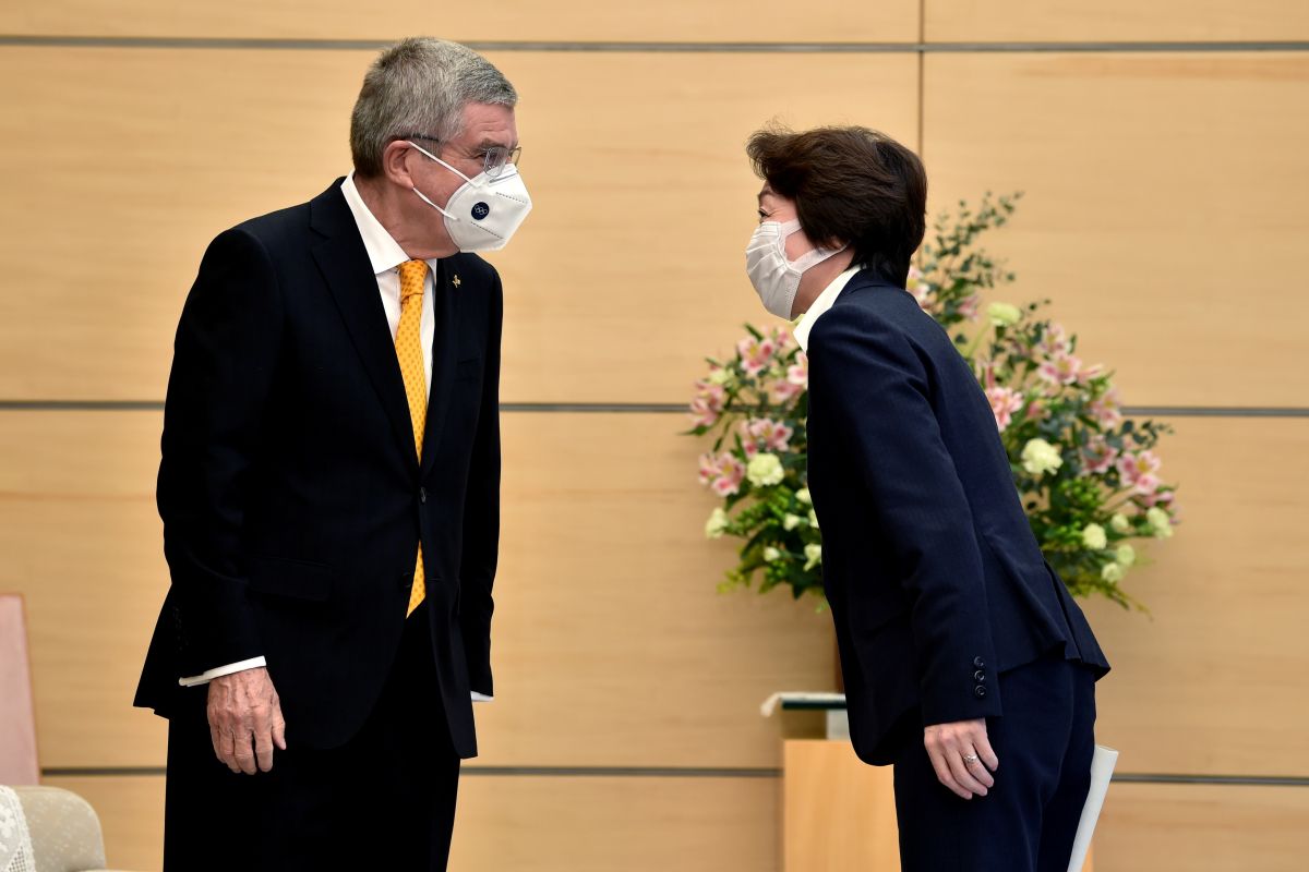 Japan's Minister for the Tokyo Olympic and Paralympic Games Seiko Hashimoto (right) greets International Olympic Committee (IOC) president Thomas Bach during a meeting in Tokyo on Tuesday