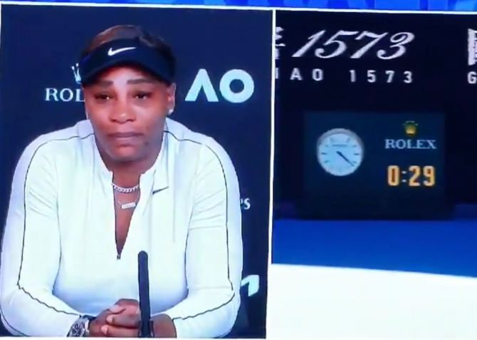 Serena Williams holds back tears while answering questions during a press conference after her semi-final loss to Naomi Osaka at the Australian Open in Melbourne on Thursday 