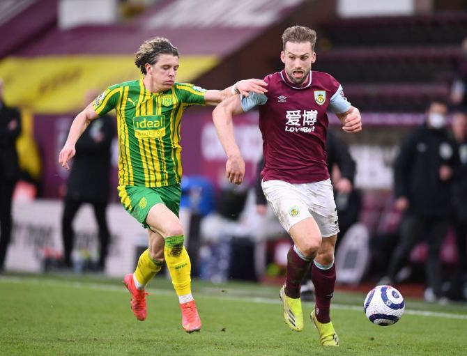Burnley's Charlie Taylor in action with West Bromwich Albion's Conor Gallagher during their Premier League match at Turf Moor, Burnley