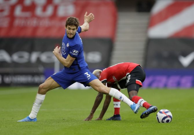 Chelsea's Marcos Alonso in action with Southampton's Moussa Djenepo