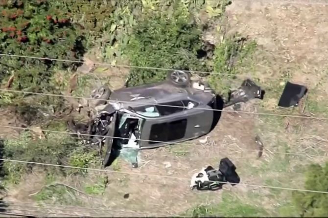 In a still image from video taken on Tuesday, the vehicle of golfer Tiger Woods lies on its side after being involved in a single-vehicle accident in Los Angeles