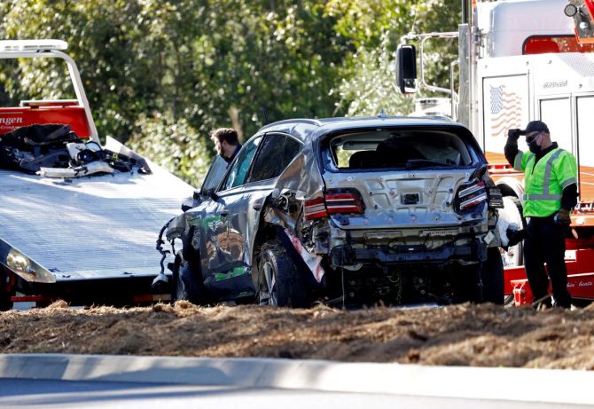 The damaged car of Tiger Woods is towed away after he was involved in a car crash, near Los Angeles on Tuesday