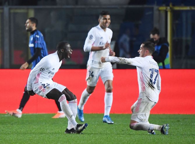 Real Madrid's Ferland Mendy celebrates with Lucas Vazquez after scoring against Atalanta during their match at Stadio Atleti Azzurri, Bergamo. 