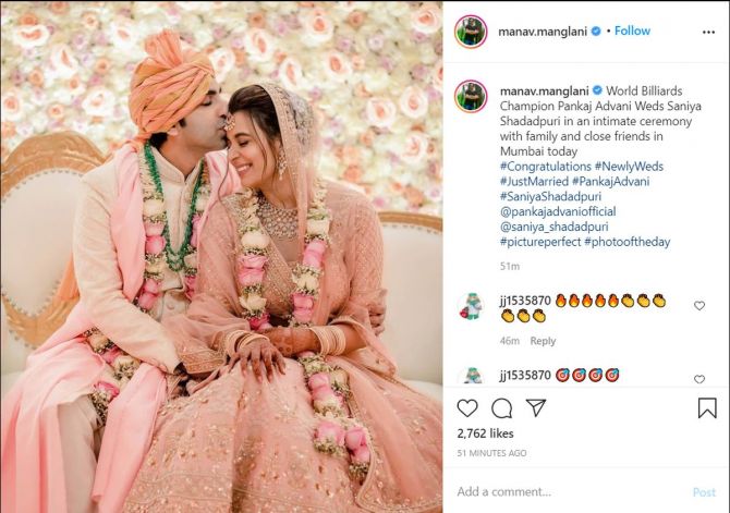 Pankaj Advani kisses his bride Saniya Shadadpuri at their wedding ceremony in Mumbai on Wednesday