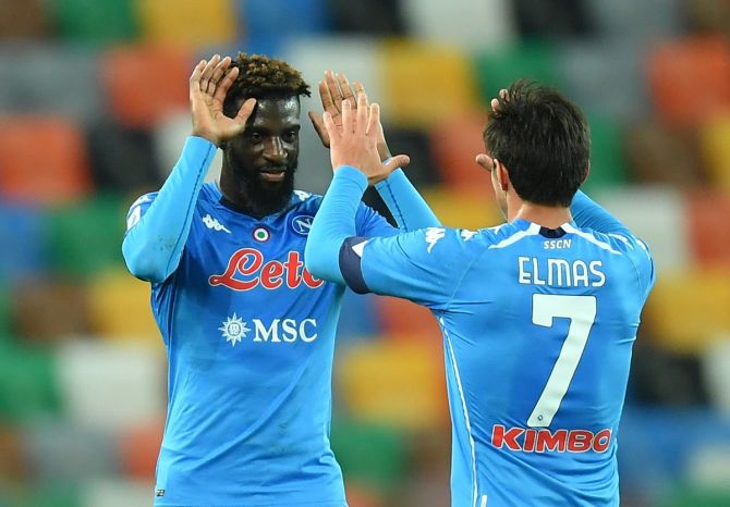 Napoli's Tiemoue Bakayoko celebrates with Elif Elmas at the end of their Serie A match against Udinese.