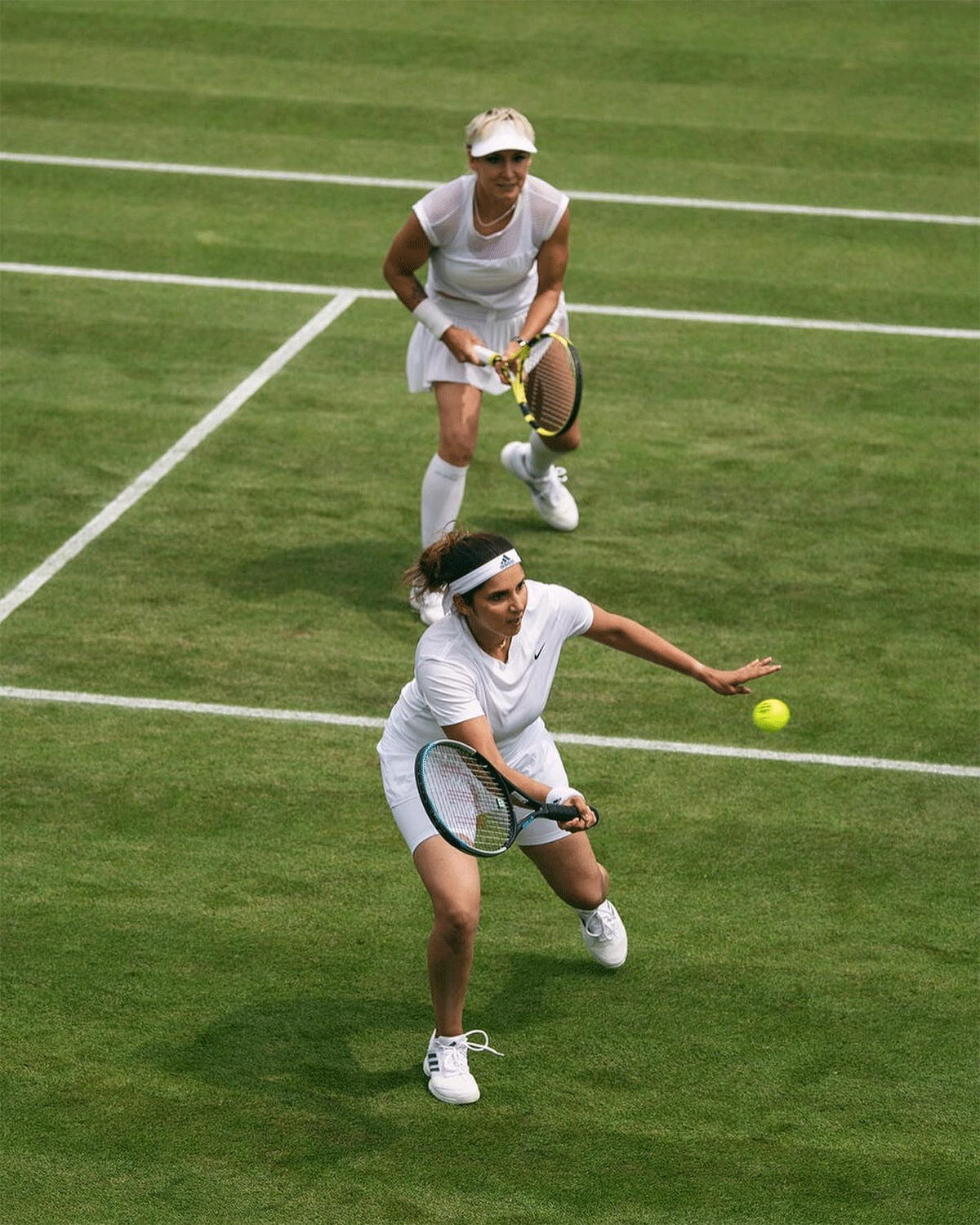 Sania Mirza and Bethanie Mattek-Sands in action during their Wimbledon doubles first-round match on Thursday