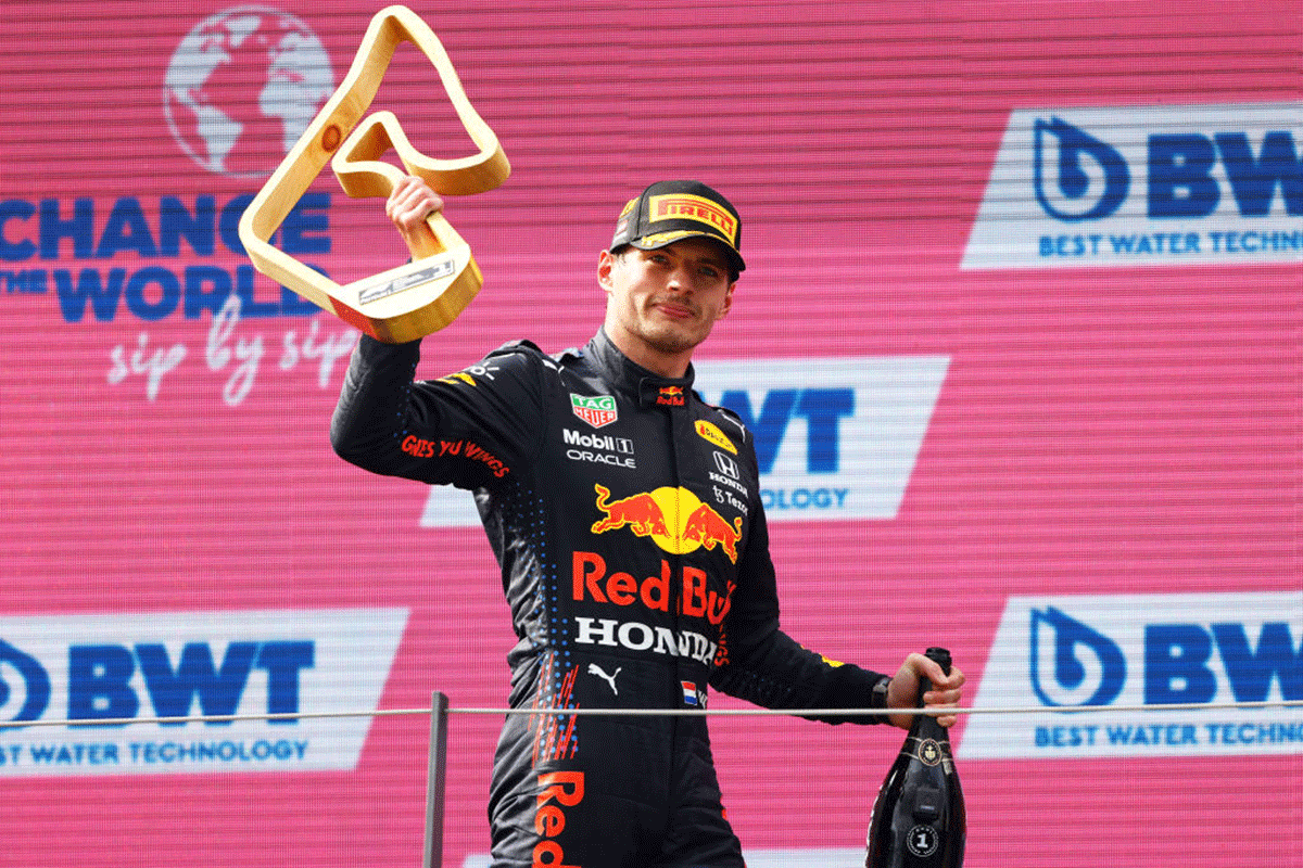 Race winner Red Bull Racing's Max Verstappen celebrates on the podium during the F1 Grand Prix of Austria at Red Bull Ring in Spielberg, Austria, on Sunday