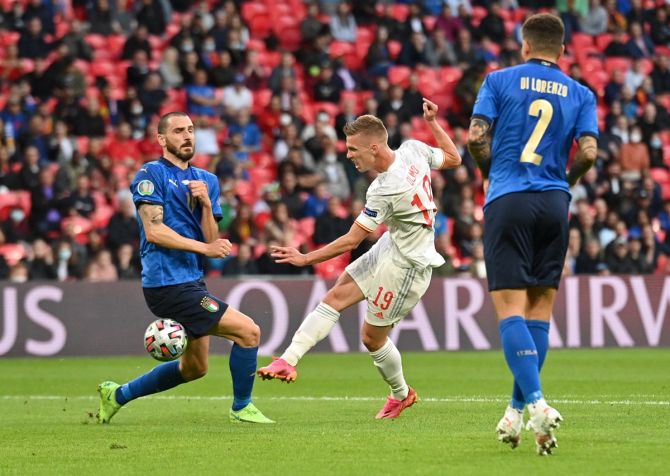 Spain's Dani Olmo has a shot at the Italian goal during the first half.