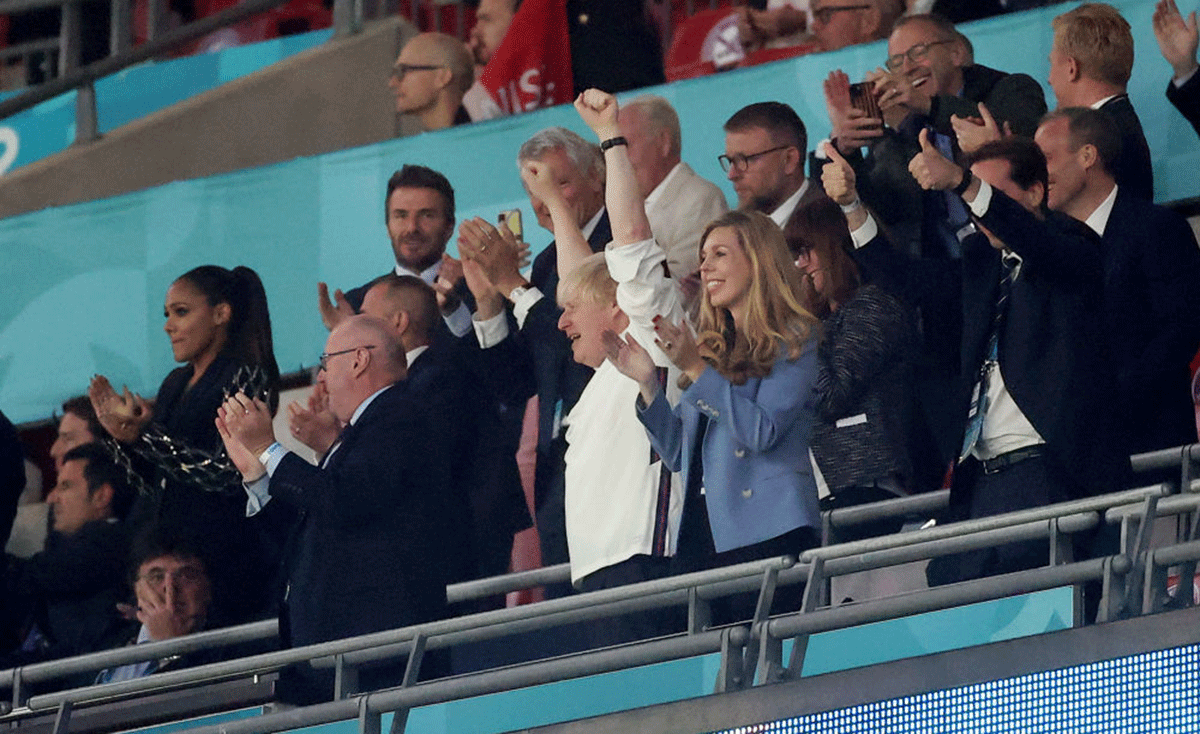 Boris Johnson celebrates after England beat Denmark to reach their first Euro final