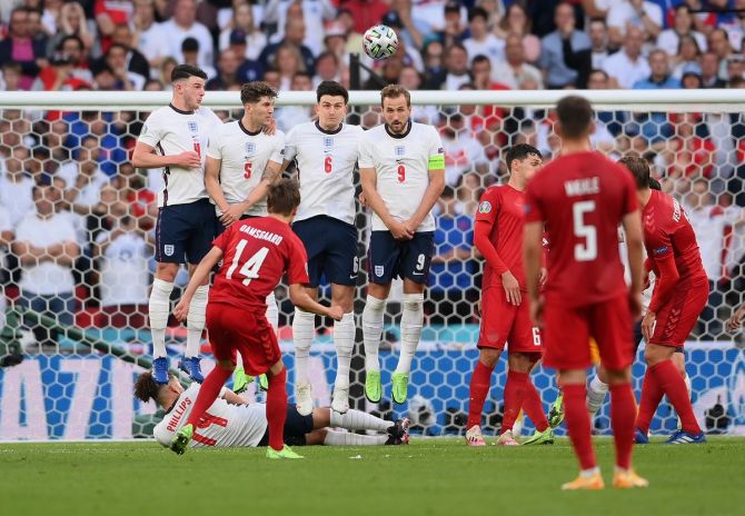 Mikkel Damsgaard floats the ball over the England defence from a free-kick to put Denmark ahead