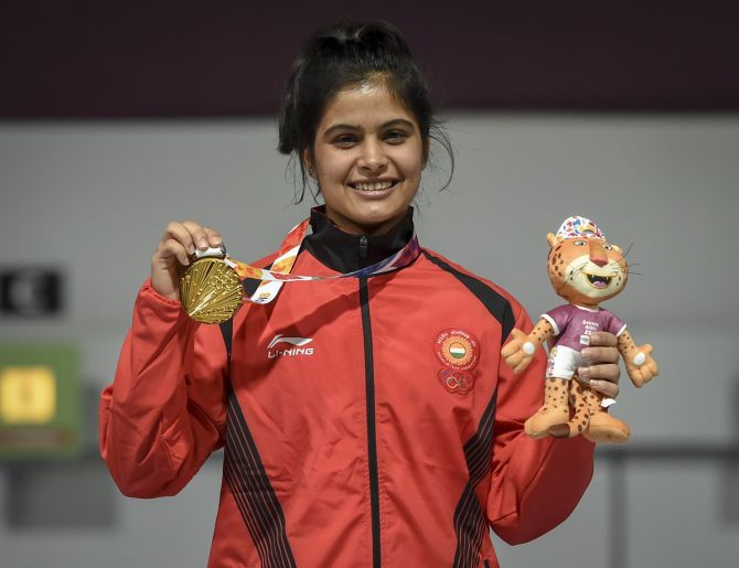 India's Manu Bhaker proudly displays her gold medal after winning the 10m Air Rifle women's event at the 2018 Youth Olympic Games