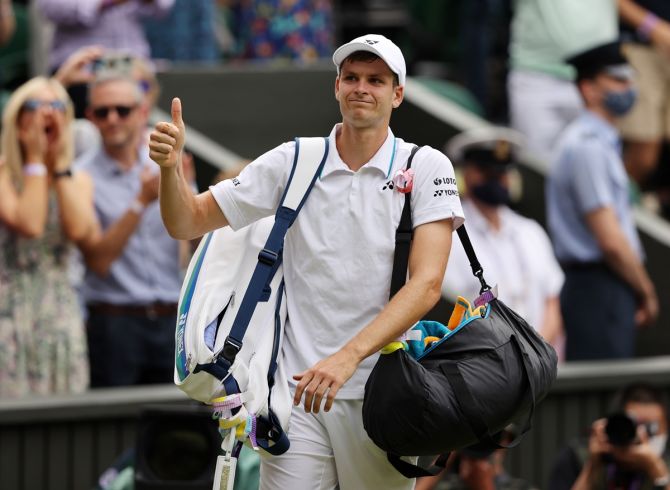 Poland's Hubert Hurkacz appreciates the applause from the crowd as he walks off the court after losing to Italy's Matteo Berrettini. 