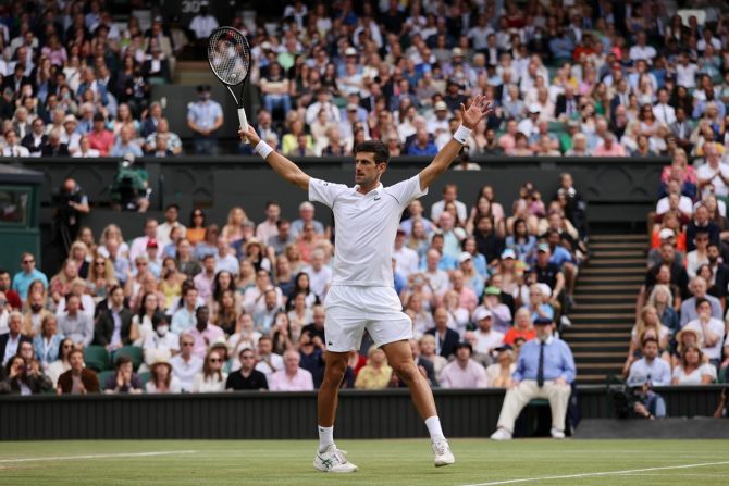 Serbia's Novak Djokovic celebrates victory over Canada's Denis Shapovalov in the men's singles semi-finals of The Championships - Wimbledon 2021, at the All-England Lawn Tennis and Croquet Club in London, on Friday