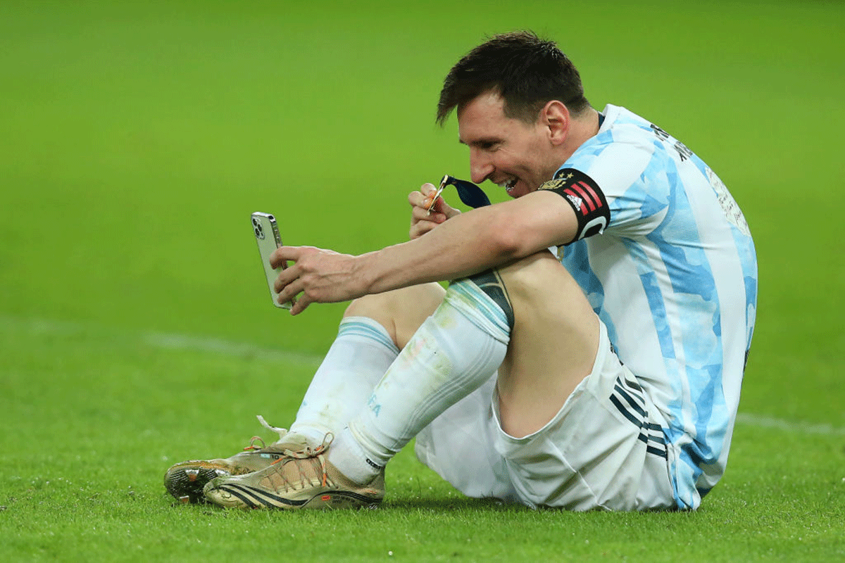 Lionel Messi shows his medal in a video call to his wife after winning the Copa America on Saturday 