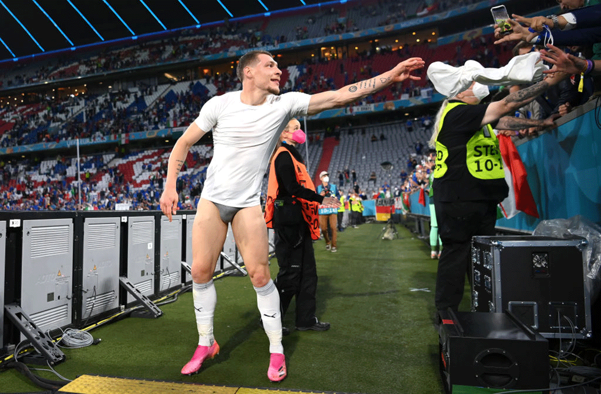 Italy's Andrea Belotti throws his shorts towards the crowd after the UEFA Euro 2020 Championship quarter-final win against Belgium at Football Arena Munich in Munich on July 2.