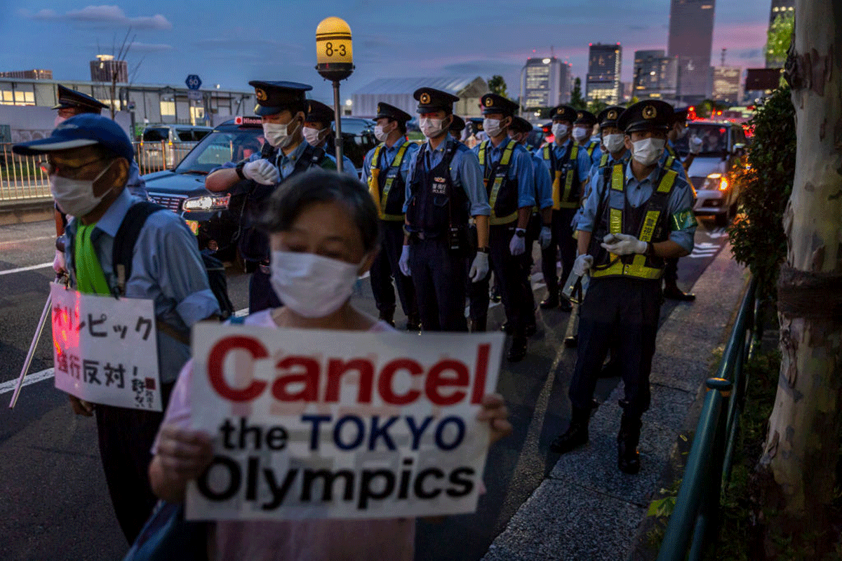 Police officers gather before a demonstration against the forthcoming Tokyo Olympic Games on Friday. 