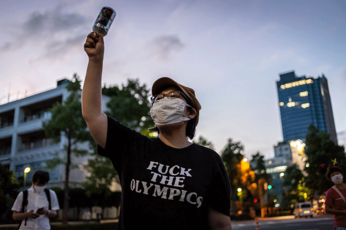A protester demonstrates against the forthcoming Tokyo Olympic Games near the Akasaka State Guest House in Tokyo.
